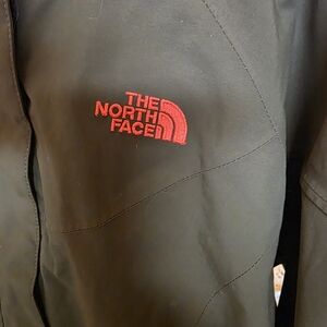 The North Face Green Jacket with Red Logo